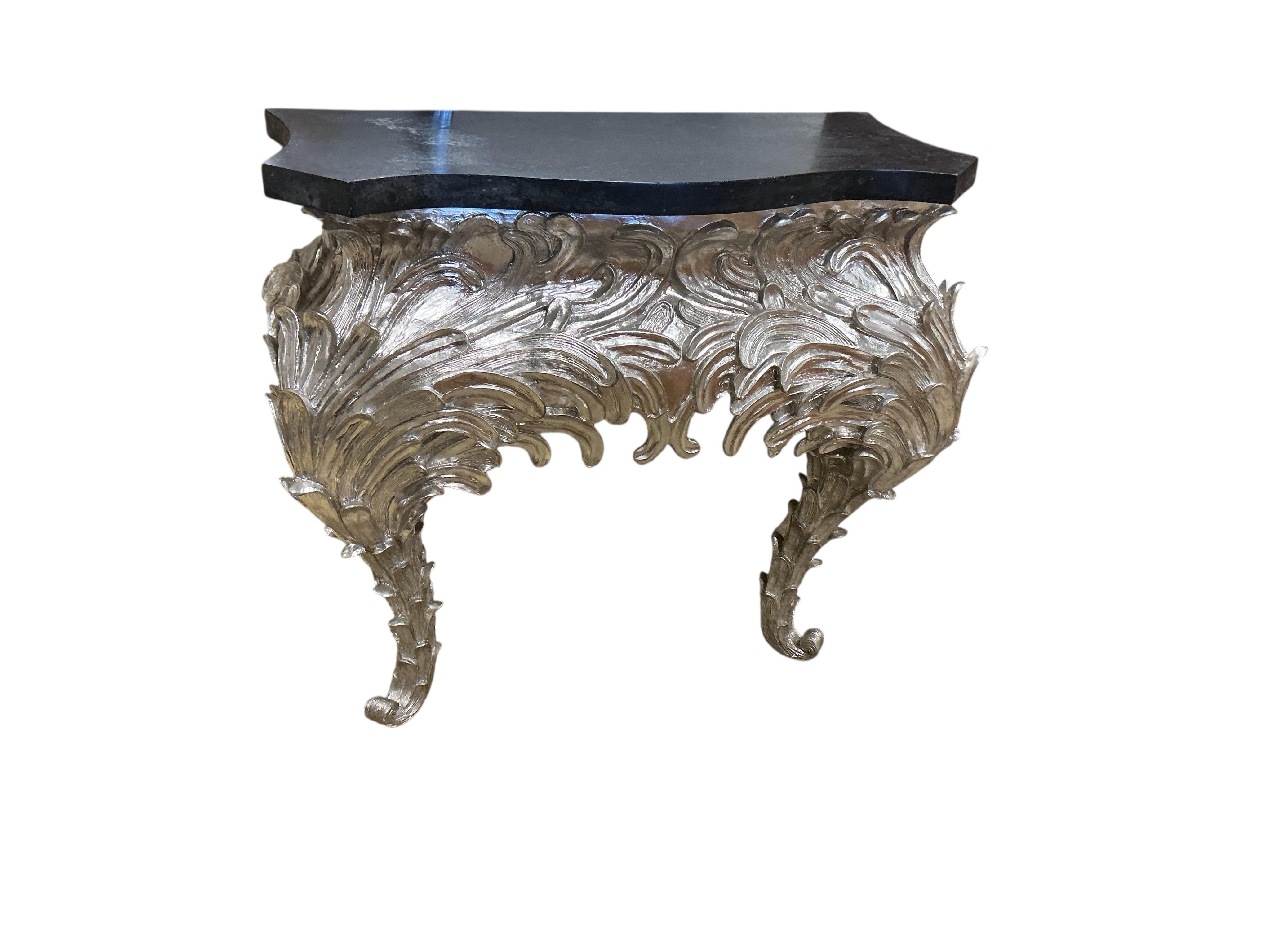 A pair of contemporary silvered composition serpentine 